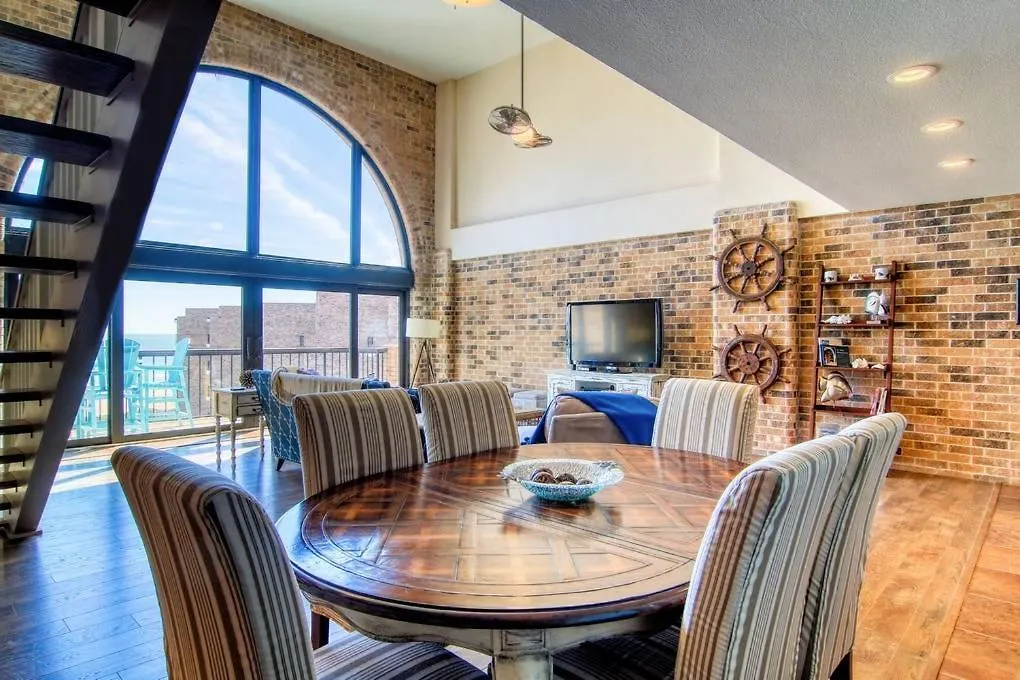Floor To Ceiling Arched Window Panoramic View Of The Coast In Split Level Penthouse